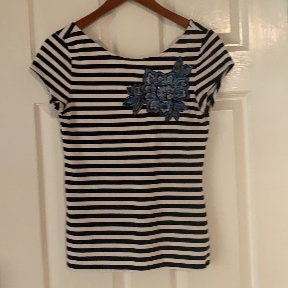 Women’s black and white striped blouse.